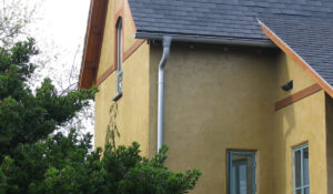 a gutter and downspout on the outside of the outside