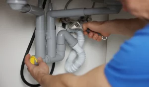 Professional repairing under-sink plumbing code violations in Naperville IL to ensure safe, compliant home drainage systems.