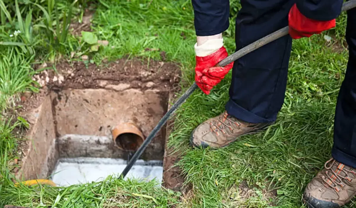 Technician performing sewer line rodding for efficient drainage in Naperville